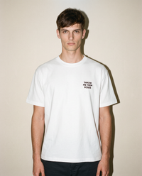 White heavyweight cotton oversized T-shirt with large 'Throw Me Them Roses' graphic slogan printed on both on the front and the back, oversized structured box fit. unisex silhouette and premium streetwear styling.